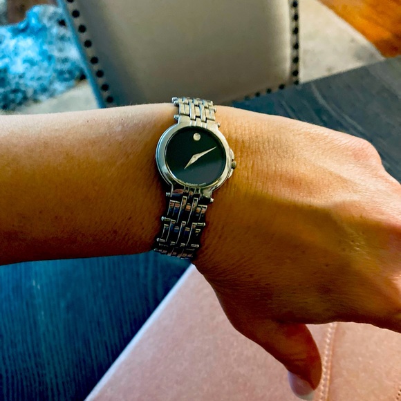 Movado Accessories - Movado black faced watch with silver band